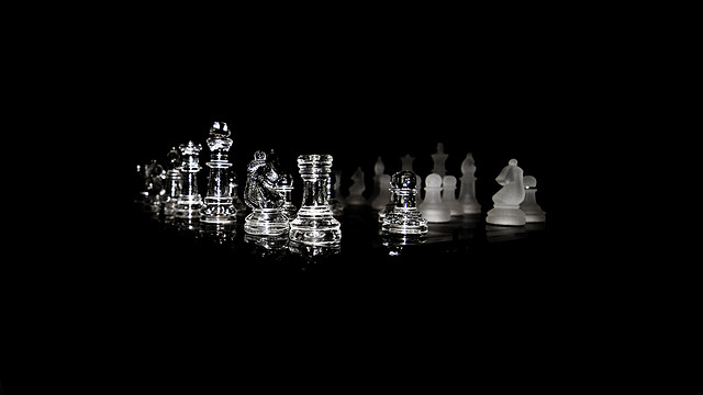 Low key, wide angle, shallow DoF photo of a chess set