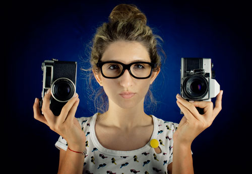 Stock Photo of woman with cameras from iStock