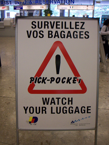 Pick pocket! Watch your luggage sign