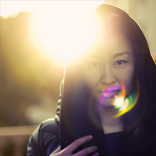 Creative use of lens flare in a portrait photo