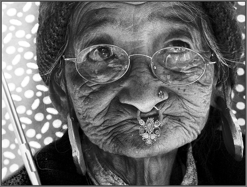 an old lady with an umbrella in Ravangla market!