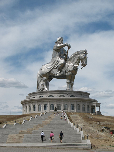 Ginormous statue of Chingis Khan, showing the scale of the statue compared to the people walking up the steps