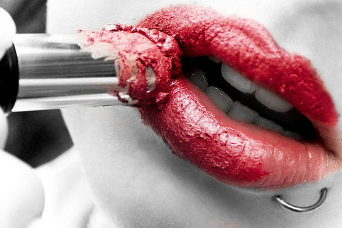 applying lipstick selective color photo