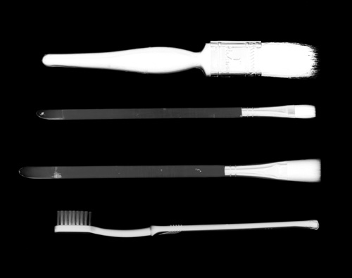 Photogram of paintbrushes and toothbrush - note the X-ray style effect