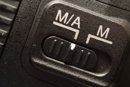 The focus switch on a Nikon lens - Autofocus is labeled as M/A to indicate that manual override is available in autofocus mode