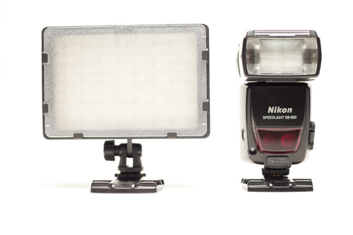 CN-160 LED light panel size compared to a Nikon SB-800 Speedlight hot shoe flash, front view