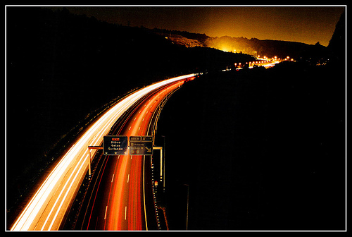 autobahn at night featuring light trails left by car headlights