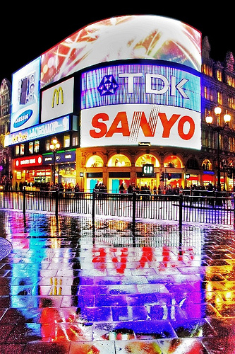 Piccadilly Circus reflections in the wet pavement on a rainy evening
