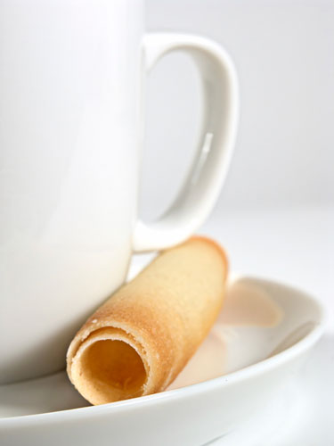 Espresso coffee cup & saucer with Belgian biscuit curl still lufe photo