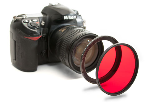 Camera, step-up ring, and filter