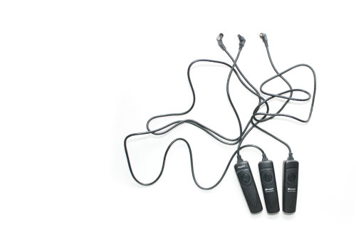 Shutter release cables path puzzle