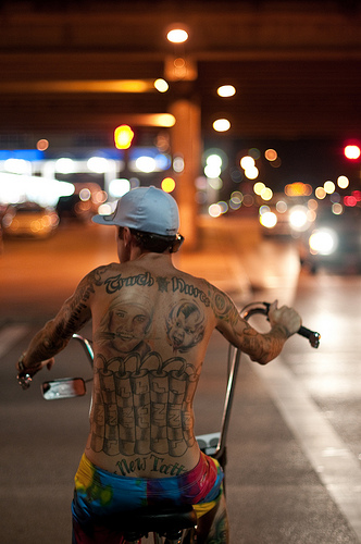 Tattooed Biker - low light photo, capturing an image in light levels like this would be very difficult with most compact cameras