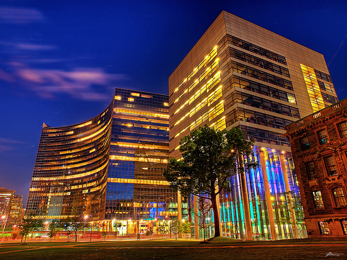 buildings lit up at twilight