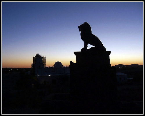 Lion statue silhouette during the blue hour