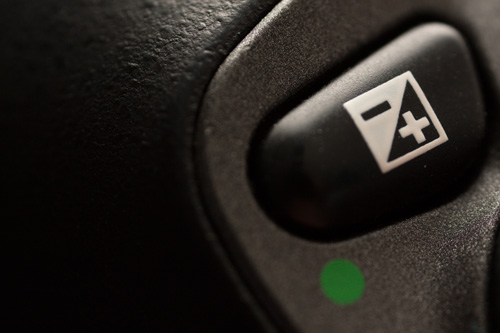 Exposure compensation button