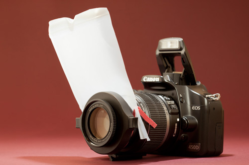 A pop-up flash diffuser for macro photography made from part of a plastic milk bottle and an elastic band