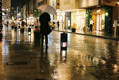 Reflections on a wet city street at night