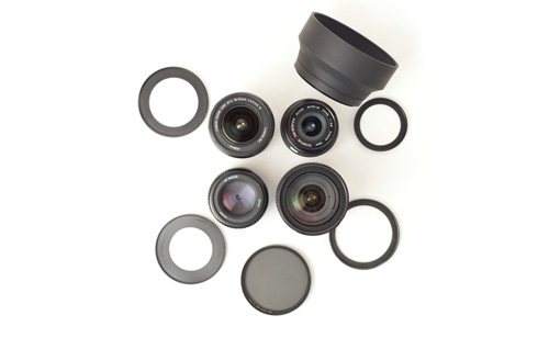 Lenses with different size filter threads, step up rings, filter, and a rubber lens hood