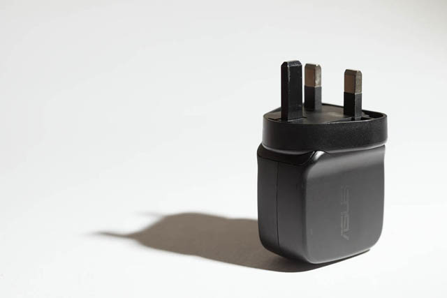 Photo of a plug taken with undiffused bare flash. Lighting is harsh.