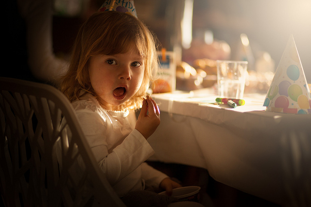 Girl at a birthday party, photographed using an 85mm fixed focal length prime lens