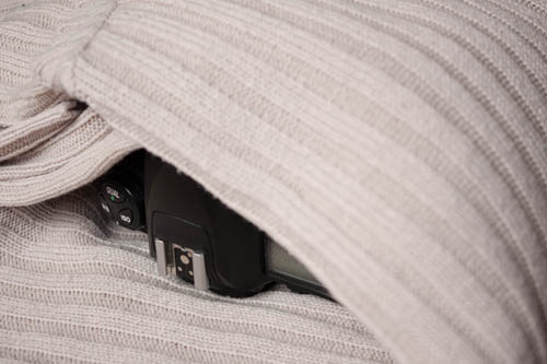 Camera wrapped in a jumper to protect it when packed