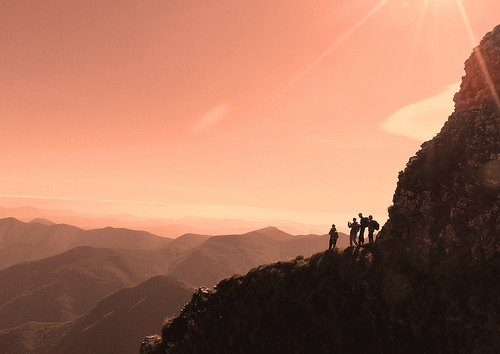 Climbers on mountain, giving a sense of scale as to how large the section of mountain framed is