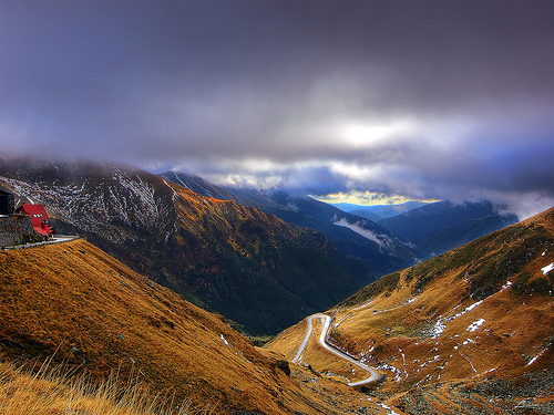 Road running down a mountain gives a sense of scale as to the mountain's size