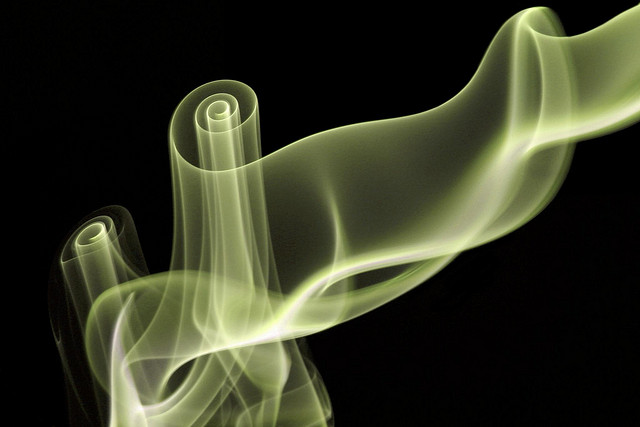 Photo of wispy smoke, with hue shifted to a yellow-green color