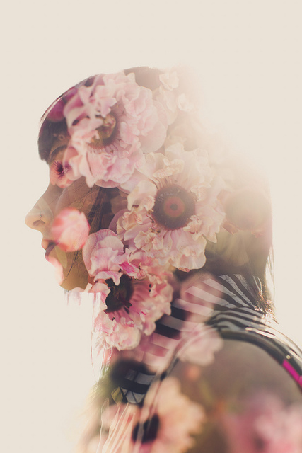 In-camera double exposure photograph of a portrait and flowers