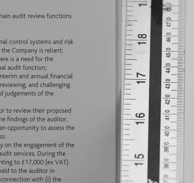 Crop of the prior image. The angled ruler provides a guide to help you see whether the lens / camera suffers from front or back focus, and how badly.