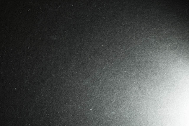 Piece of black card lit by Speedlight fired at full power, the color temperature is slightly warmer than the previous image