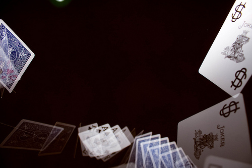 Flying playing cards photographed using stroboscopic flash