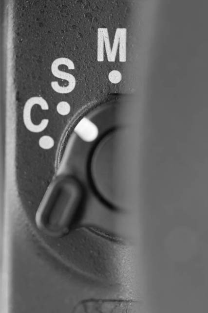 Autofocus mode selection lever on a Nikon DSLR camera