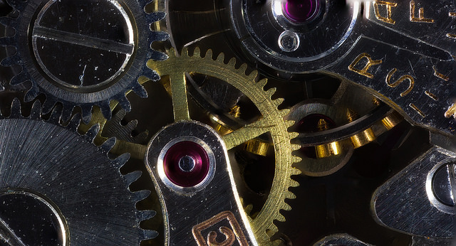 Extreme macro of cogs and gears in a mechanical watch, focus stacked image taken using a Canon MP-E 65mm lens