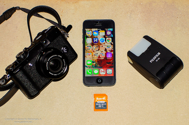 Example of a Nimble Photographer's kit - A Fujifilm X10 camera, Fujifilm EF-20 flash, iPhone 5, and an Eye-Fi memory card