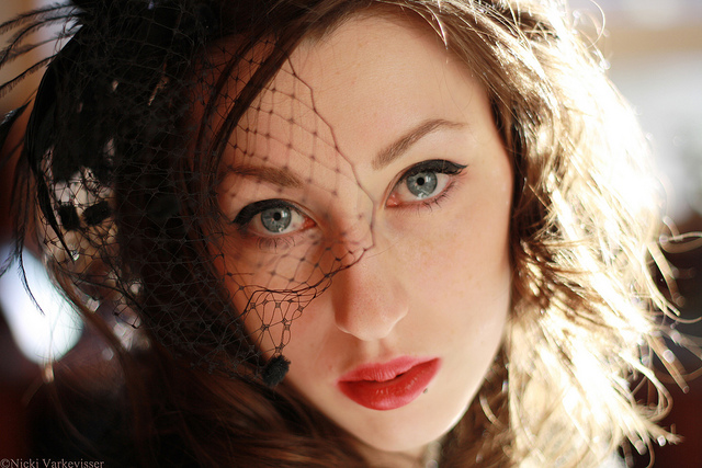 Portrait photo with a shallow depth of field where the subject is looking at the camera, so both eyes fall within the plane of sharp focus