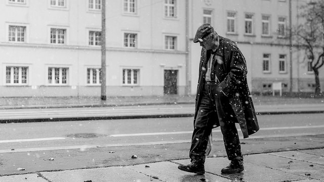 Street photography - man walking in the snow