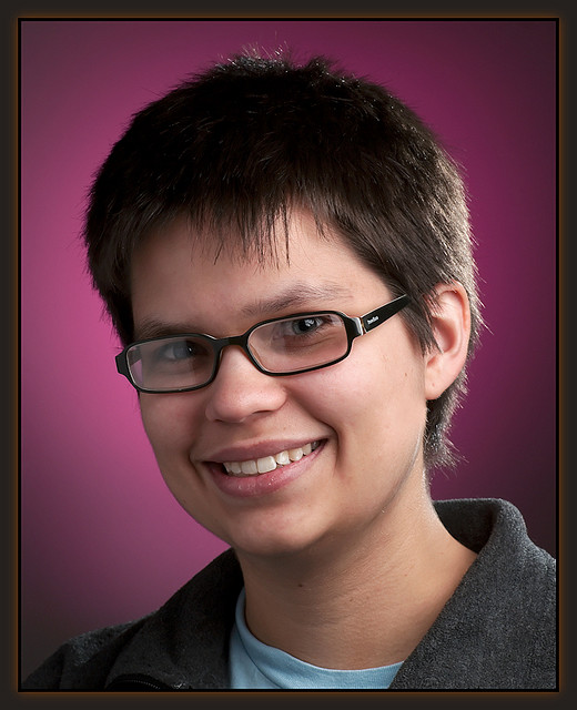 Portrait photo where a black reflector was used to flag off the main light and prevent it spilling onto the background