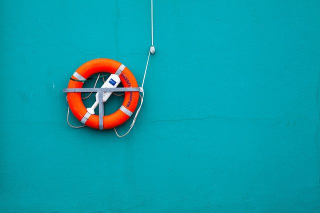 Example of a strong color contrast working well - an orange life ring mounted on a turquoise wall