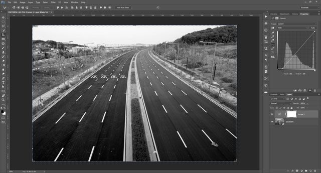 Image with increased contrast by pulling in black and white points on the curve