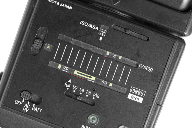 Example of another old auto flash with sliders to help setting and determining the correct settings for exposure. Again, a number of different power auto modes are available.