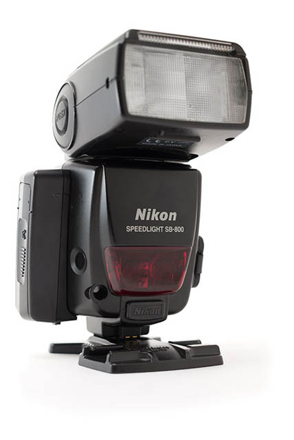 Speedlight with extra battery pack attached